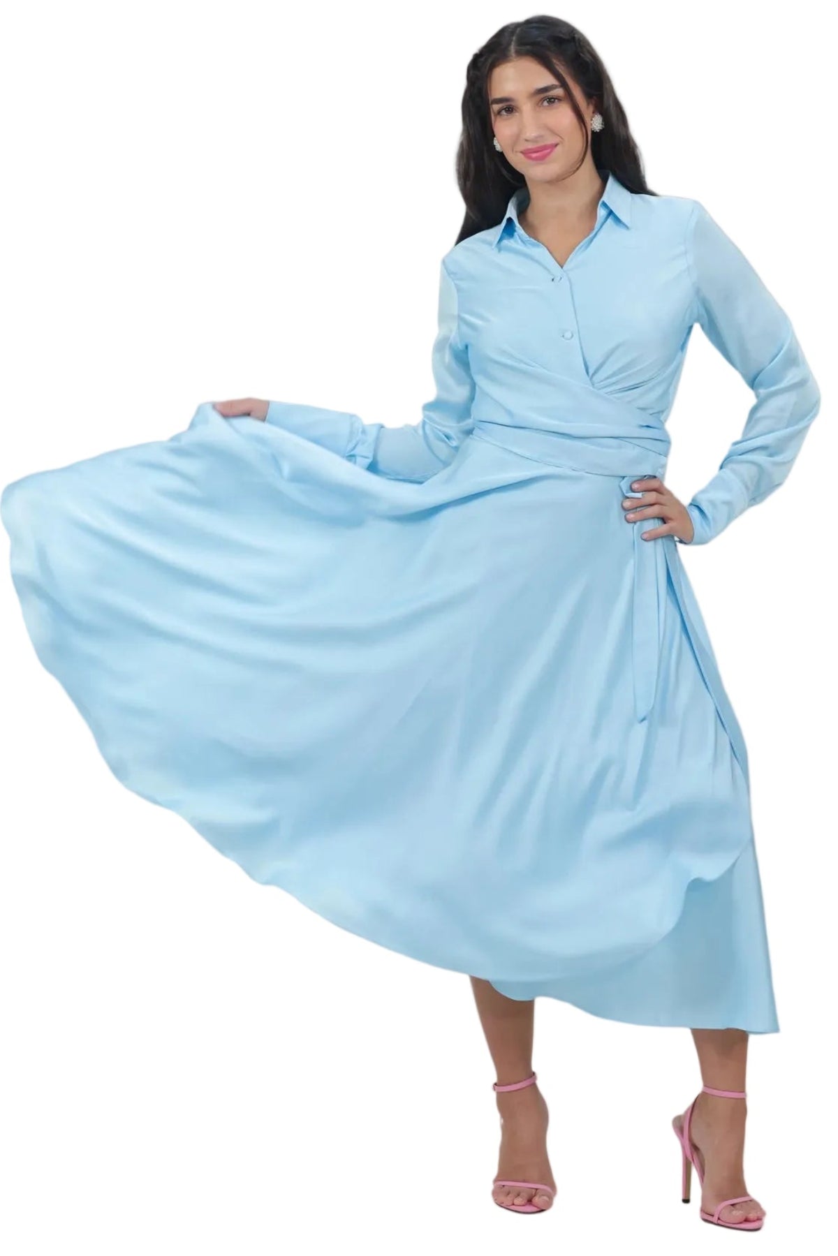A woman modeling a light blue long-sleeve midi dress with a button-up collar and gathered waist, shown against a plain white background.