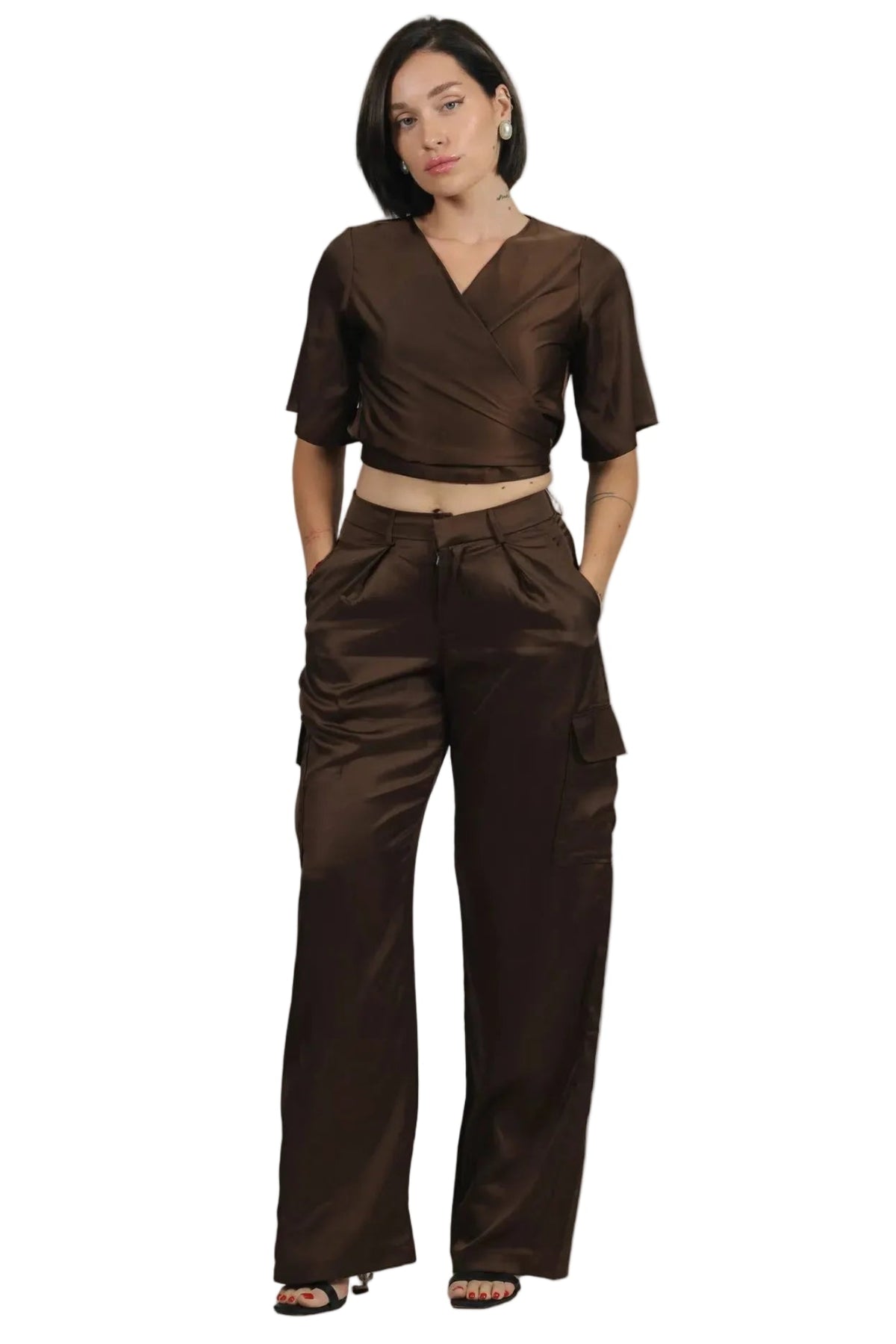 Woman wearing a brown outfit on a beige background