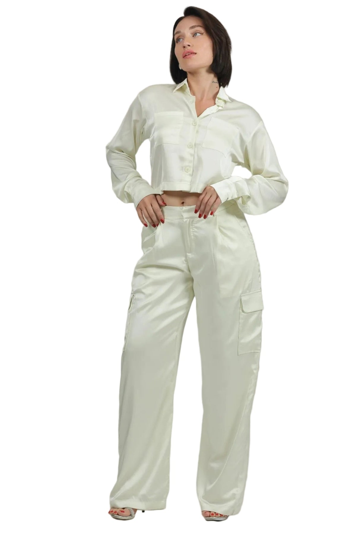 Woman wearing a white outfit on a beige background