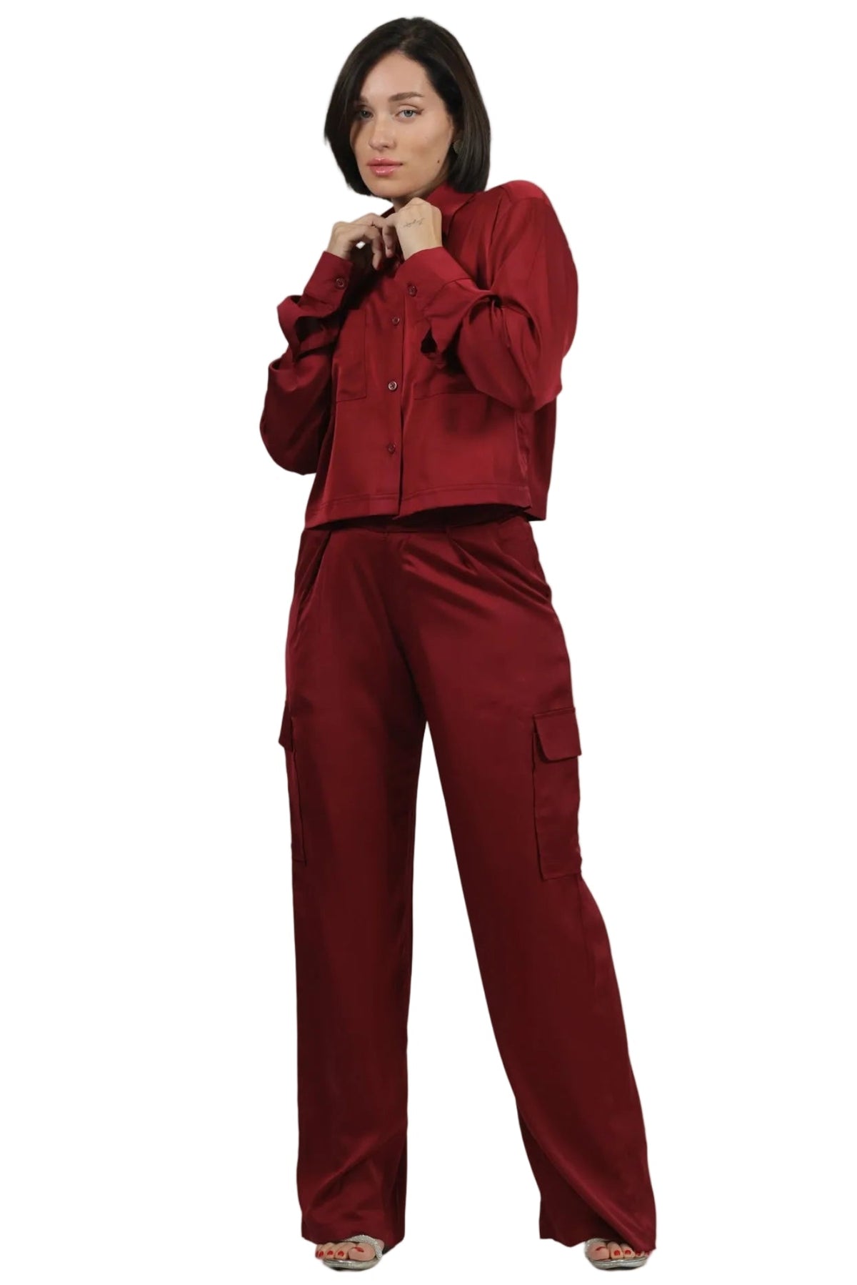 Woman wearing a red outfit on a beige background