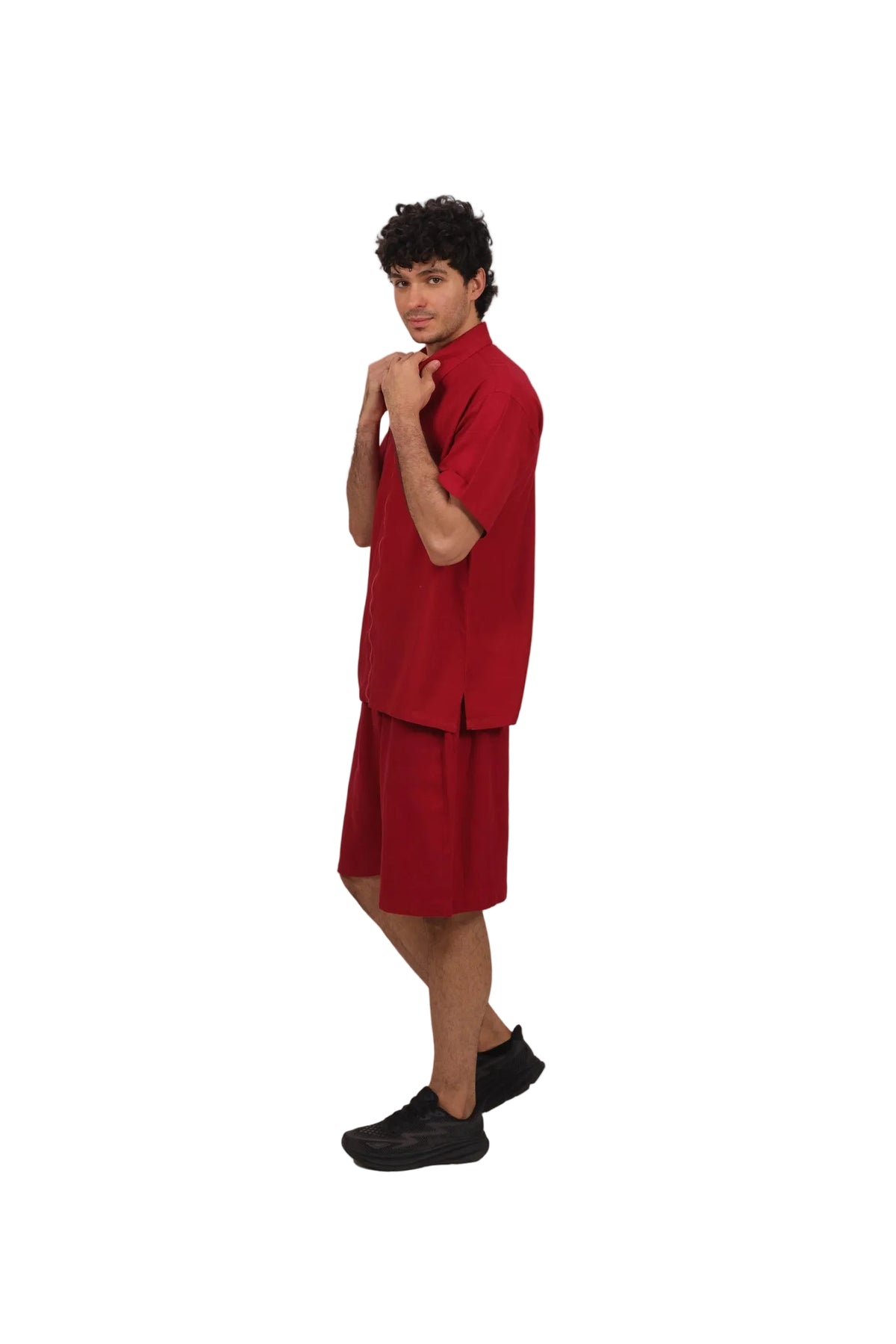 Person wearing a red outfit on a beige background