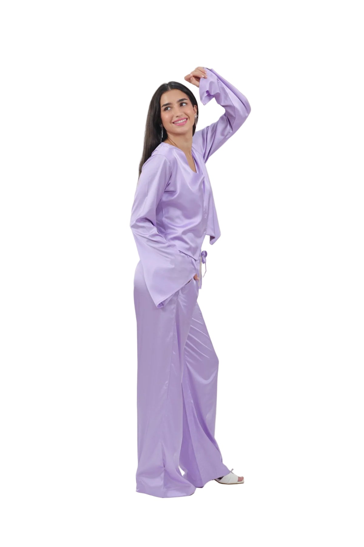 Woman wearing a light purple outfit on a beige background