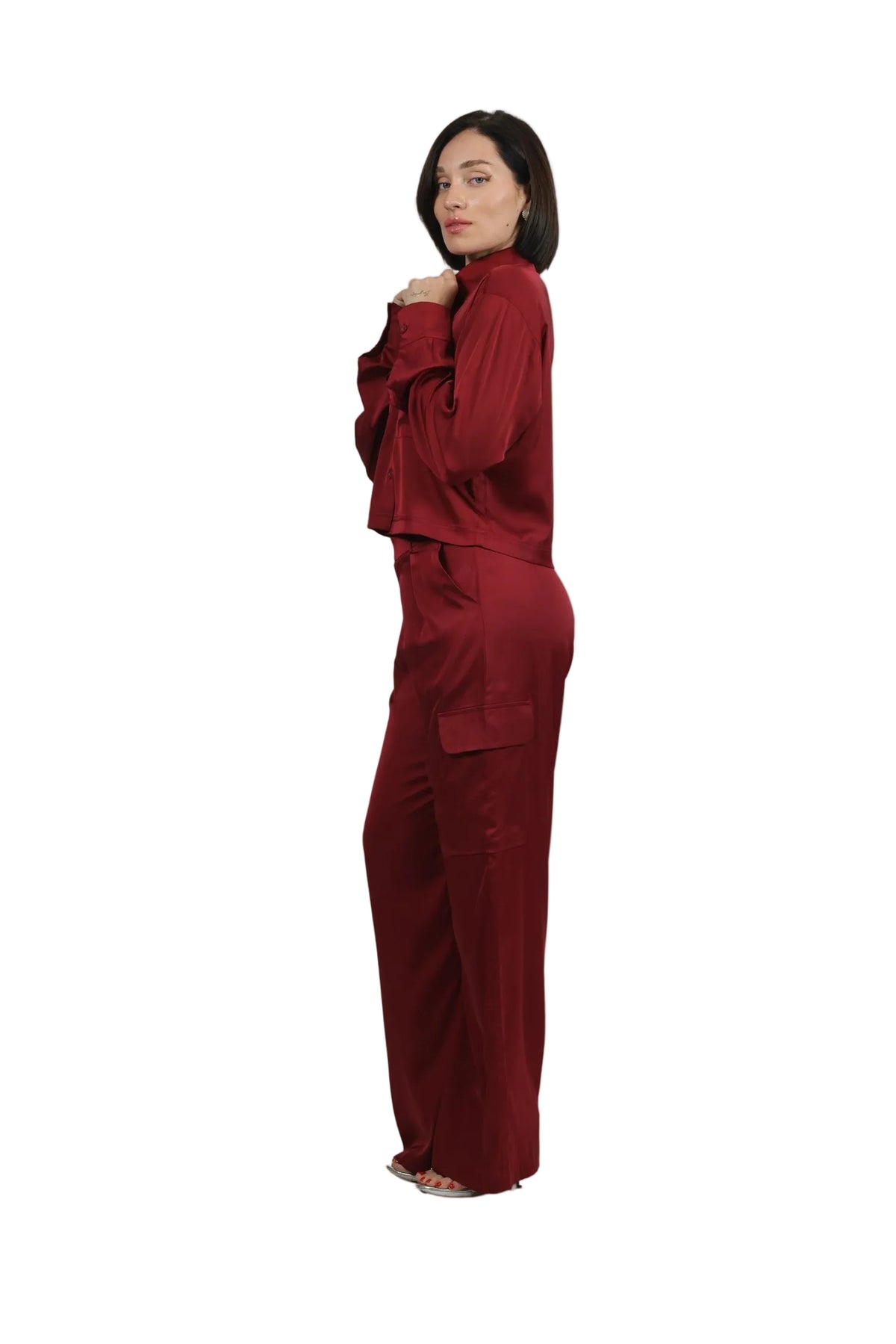 Woman wearing a red outfit on a beige background