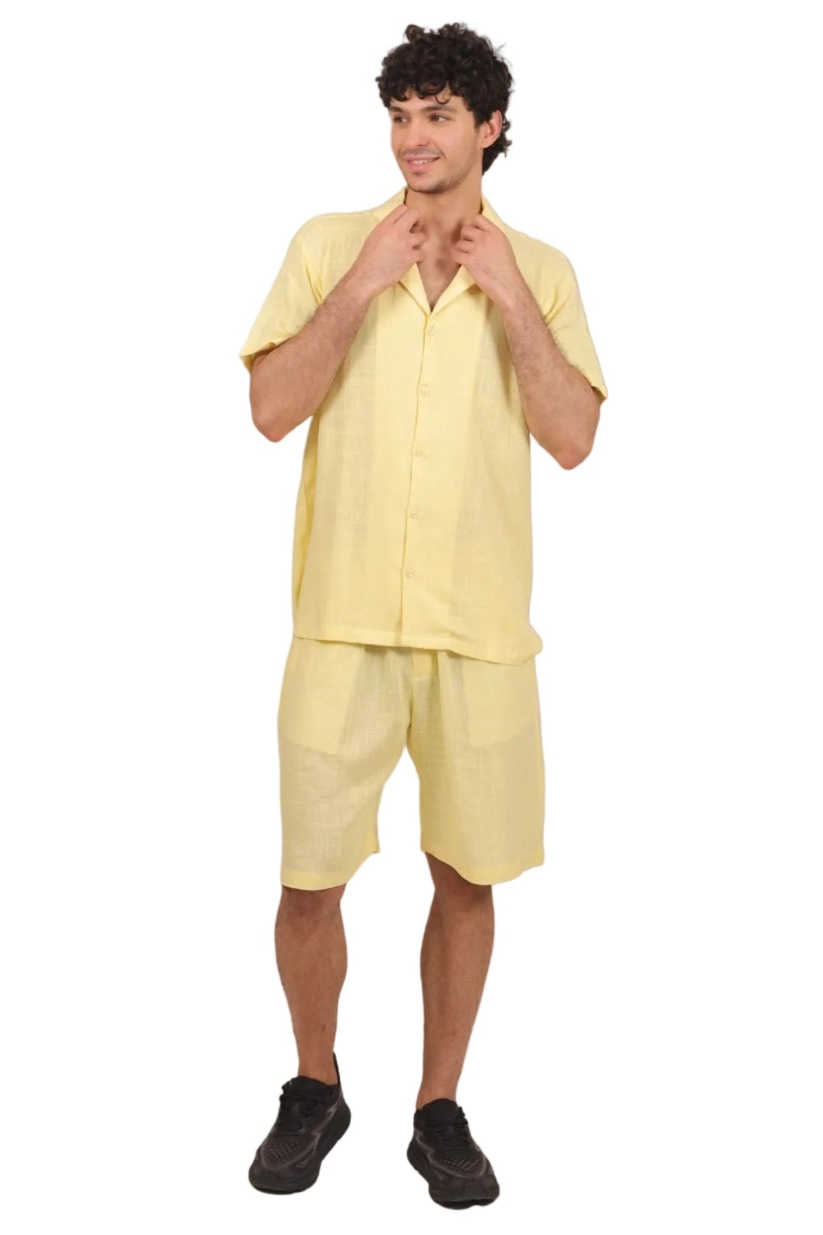 Person wearing a yellow outfit on a beige background