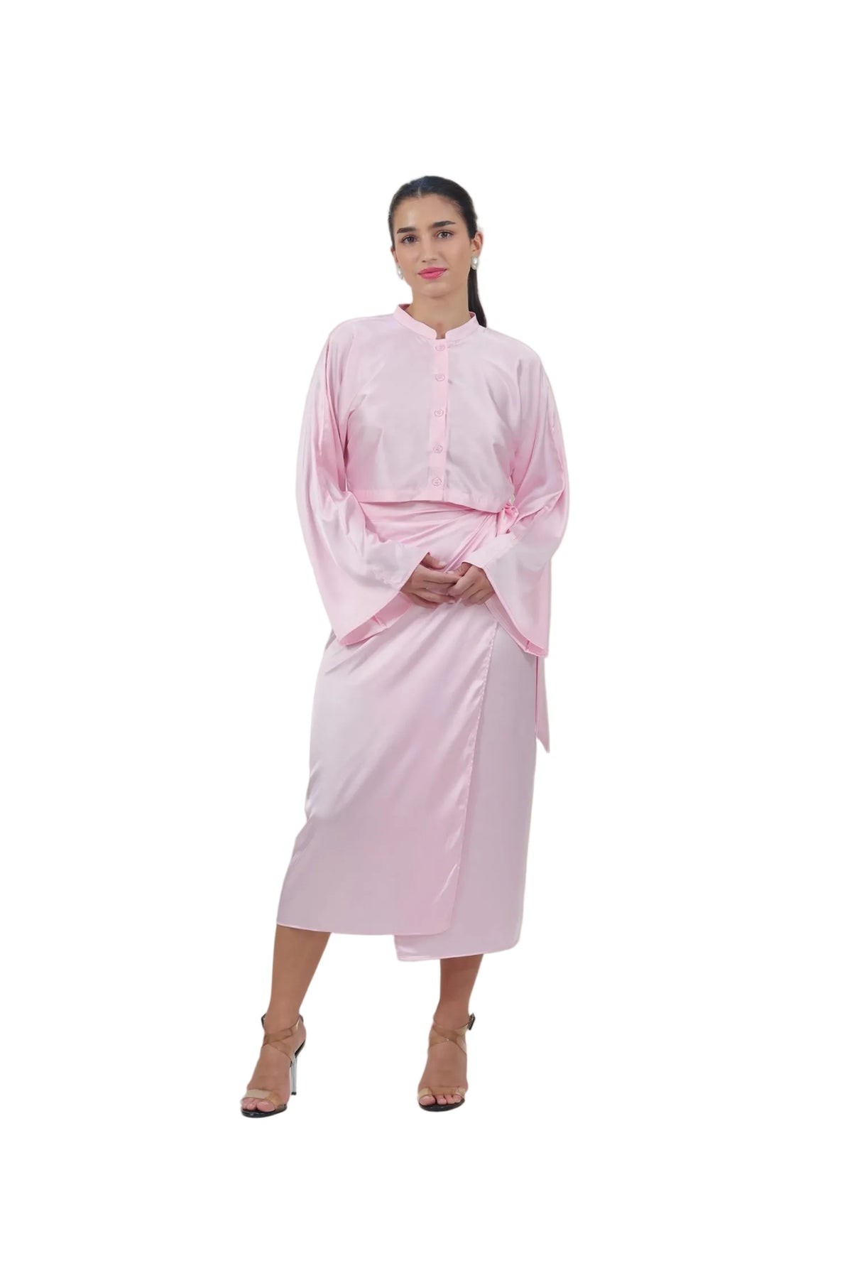 Woman wearing a light pink dress against a beige background