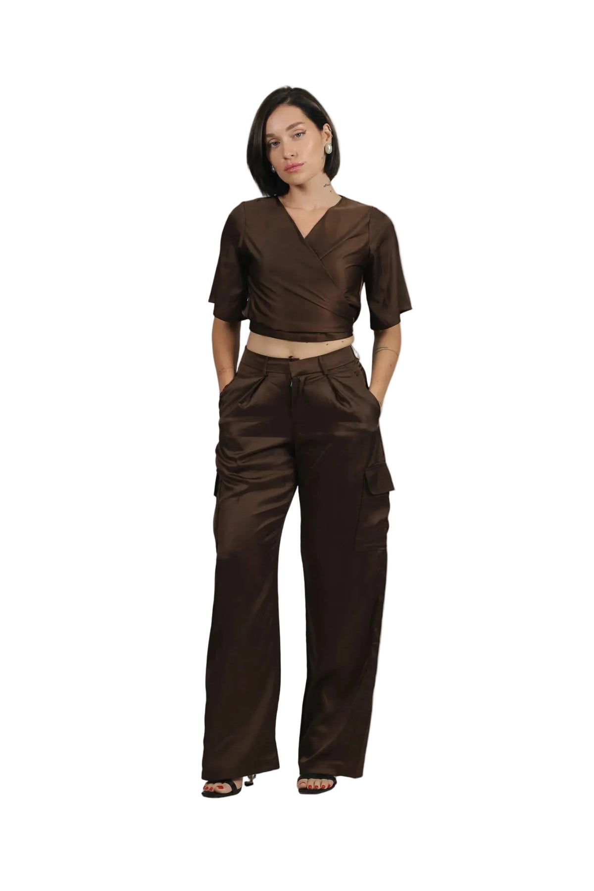 Woman wearing a brown outfit on a beige background