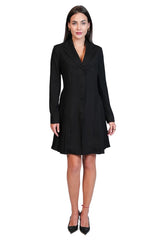 A woman modeling a black long-sleeve knee-length blazer dress with a button front, shown against a plain white background.