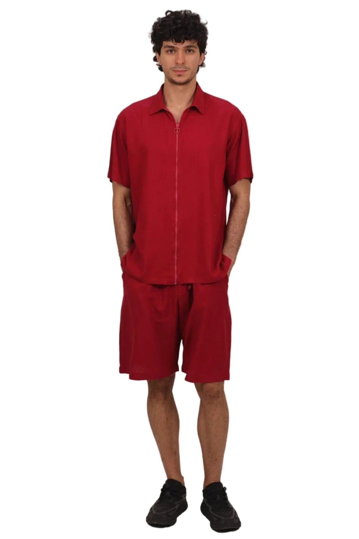 Person wearing a red outfit on a beige background