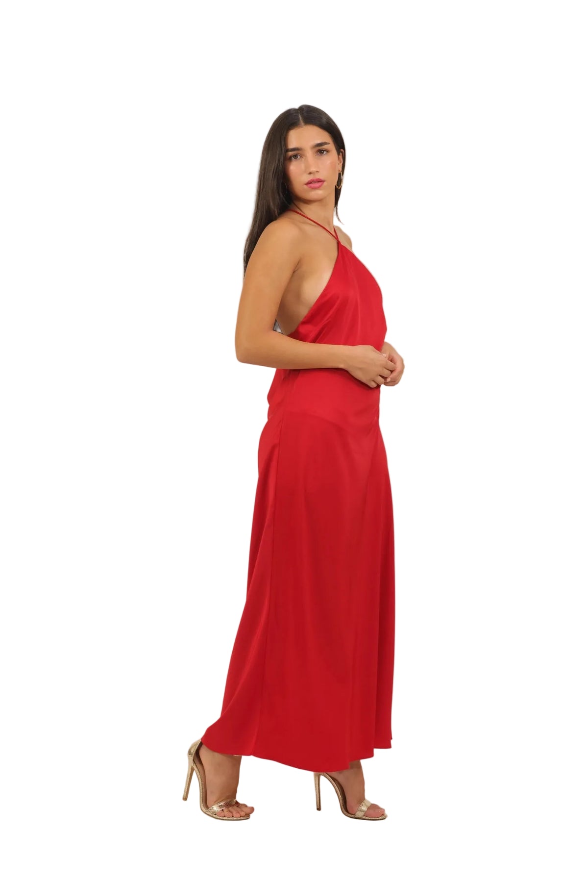 Woman wearing a red halter neck dress on a beige background