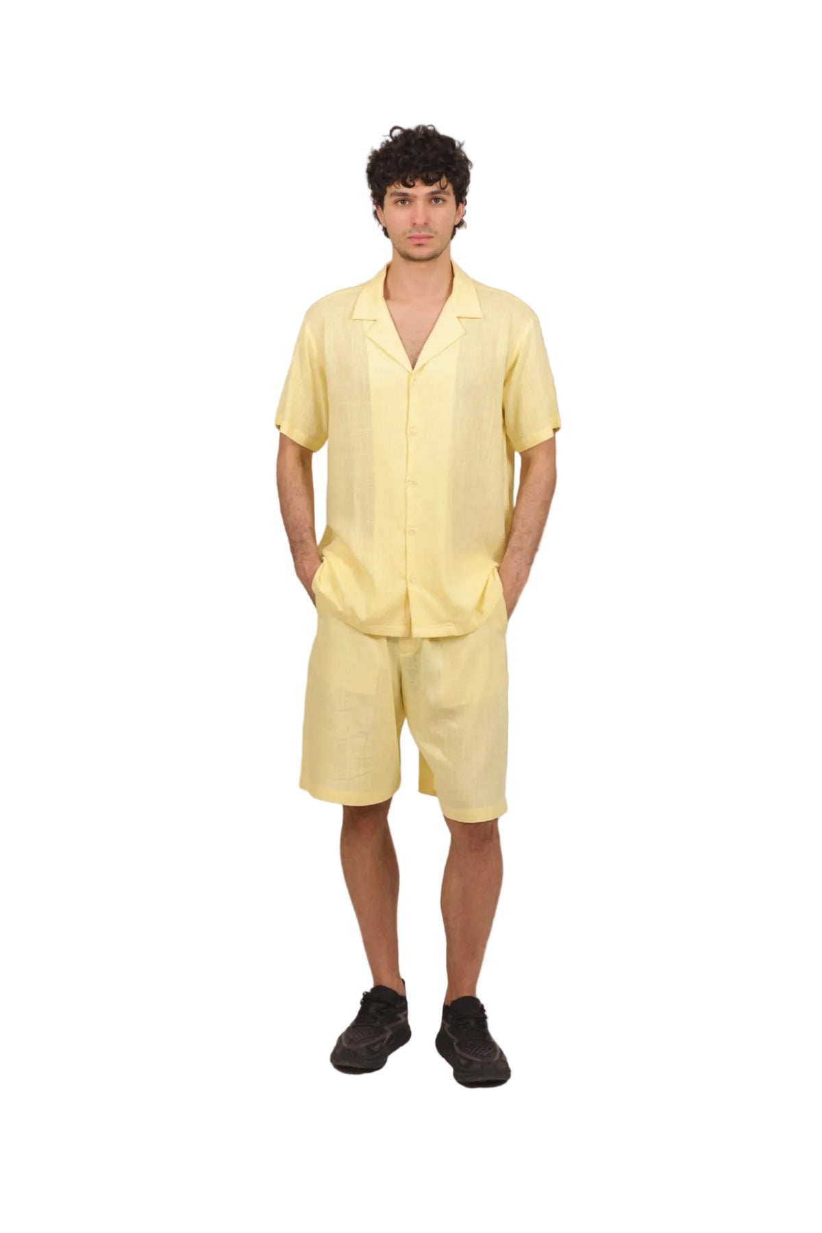 Man wearing a yellow outfit on a beige background