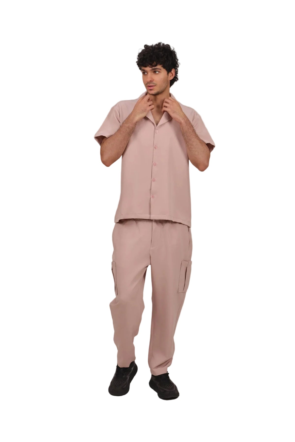 Man wearing a pink outfit on a beige background