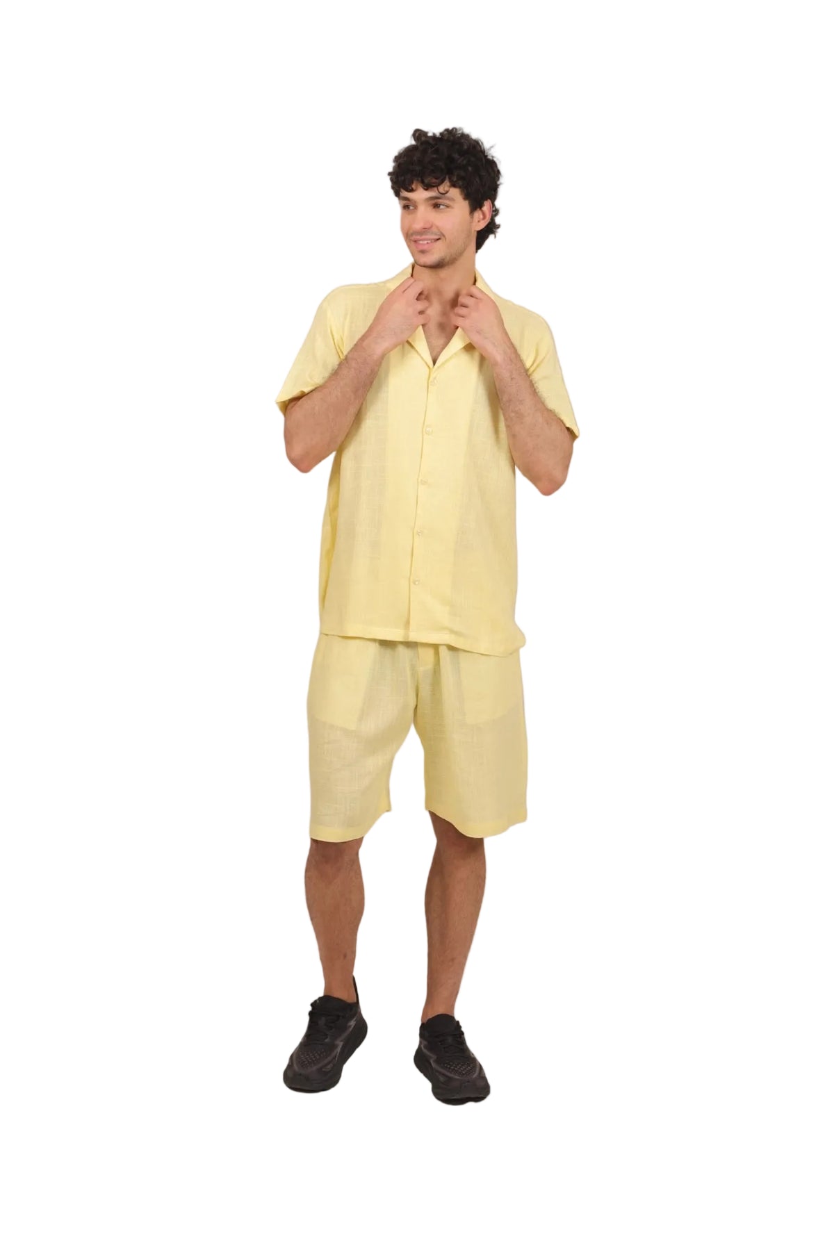 Person wearing a yellow outfit on a beige background