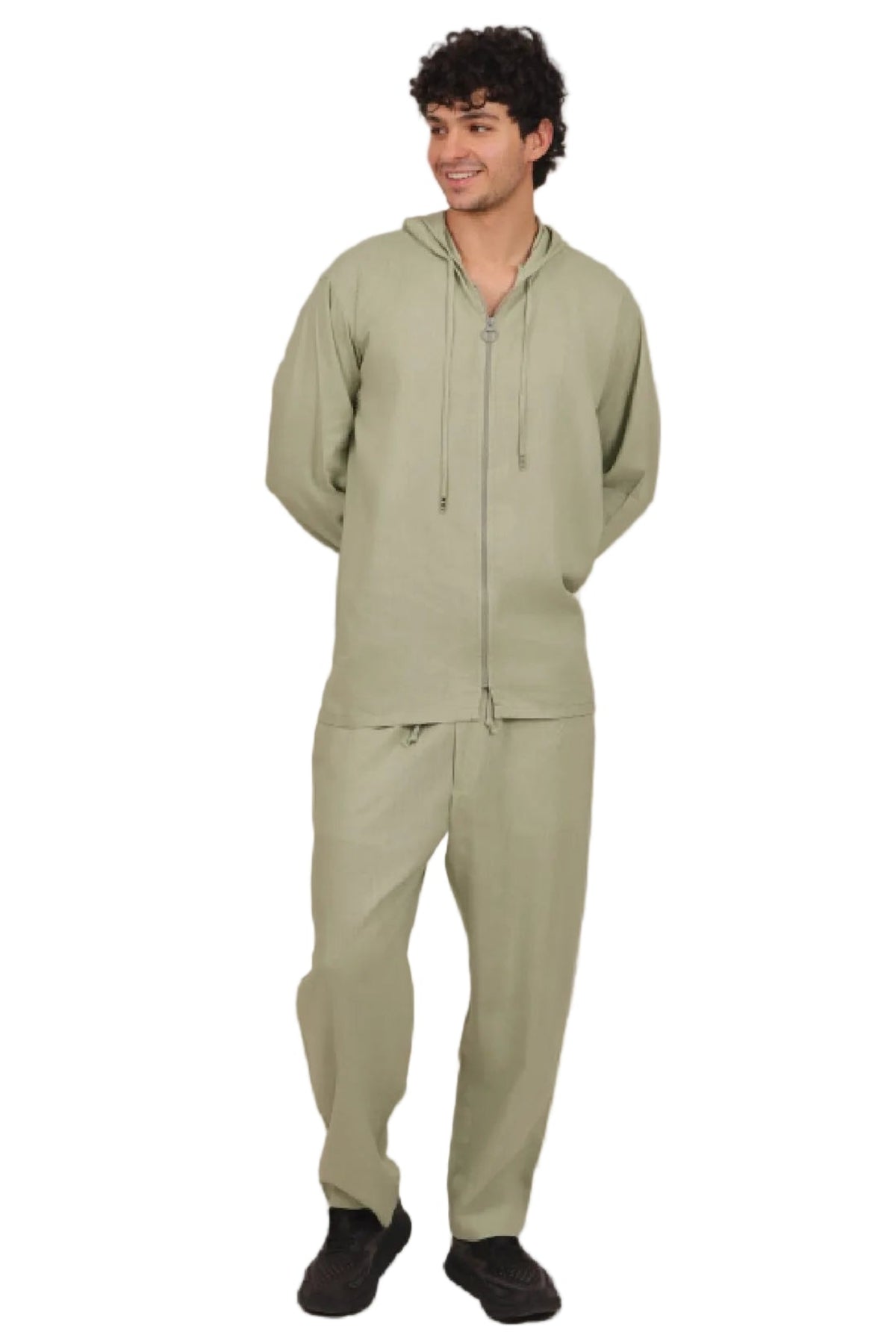 Man wearing a green tracksuit on a beige background